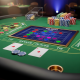Vibrant digital baccarat pattern display (scorecard) on a luxurious green felt table with casino chips and playing cards in a premium online live casino setting, illustrating the article's theme of baccarat patterns.